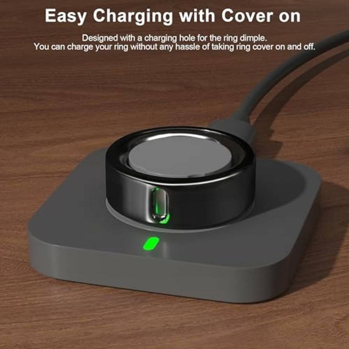 Black ring cover with charging slot and green light glow on base