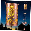 Lit solar butterfly wind chime lantern with copper-pink metal cylinder, butterflies, and chime rods