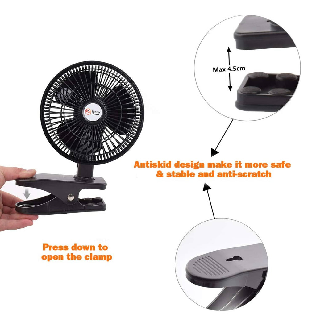 Black clip-on desk fan with clamp mount and adjustable neck, hand holding base.