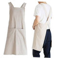 Light beige cross-back cooking apron with front pocket, wide chest straps