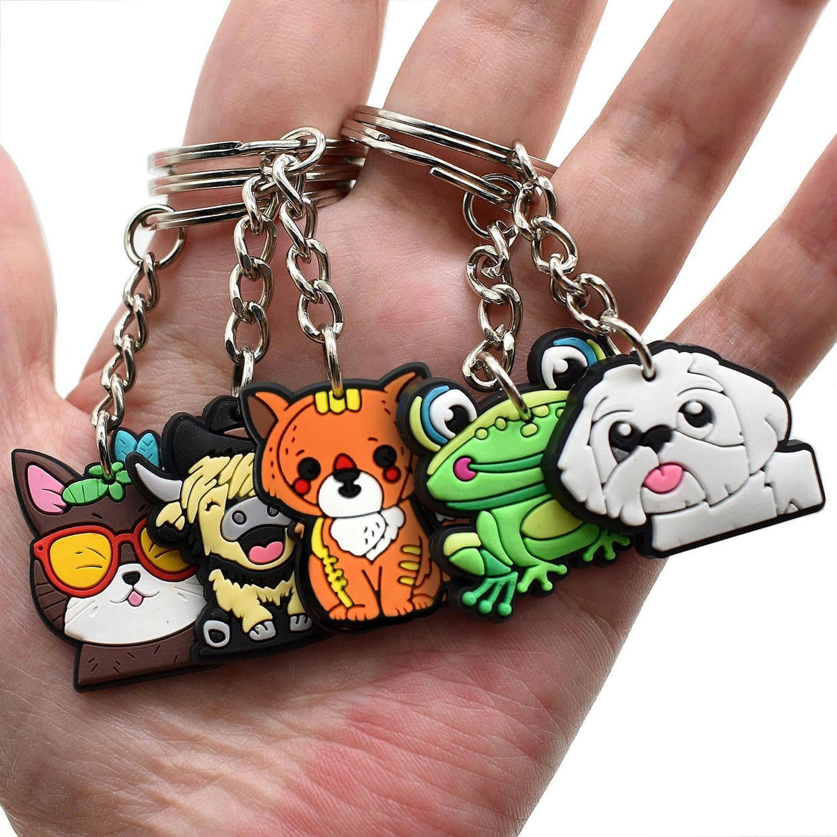 Handheld set of colorful animal cartoon charm keychains on silver key rings