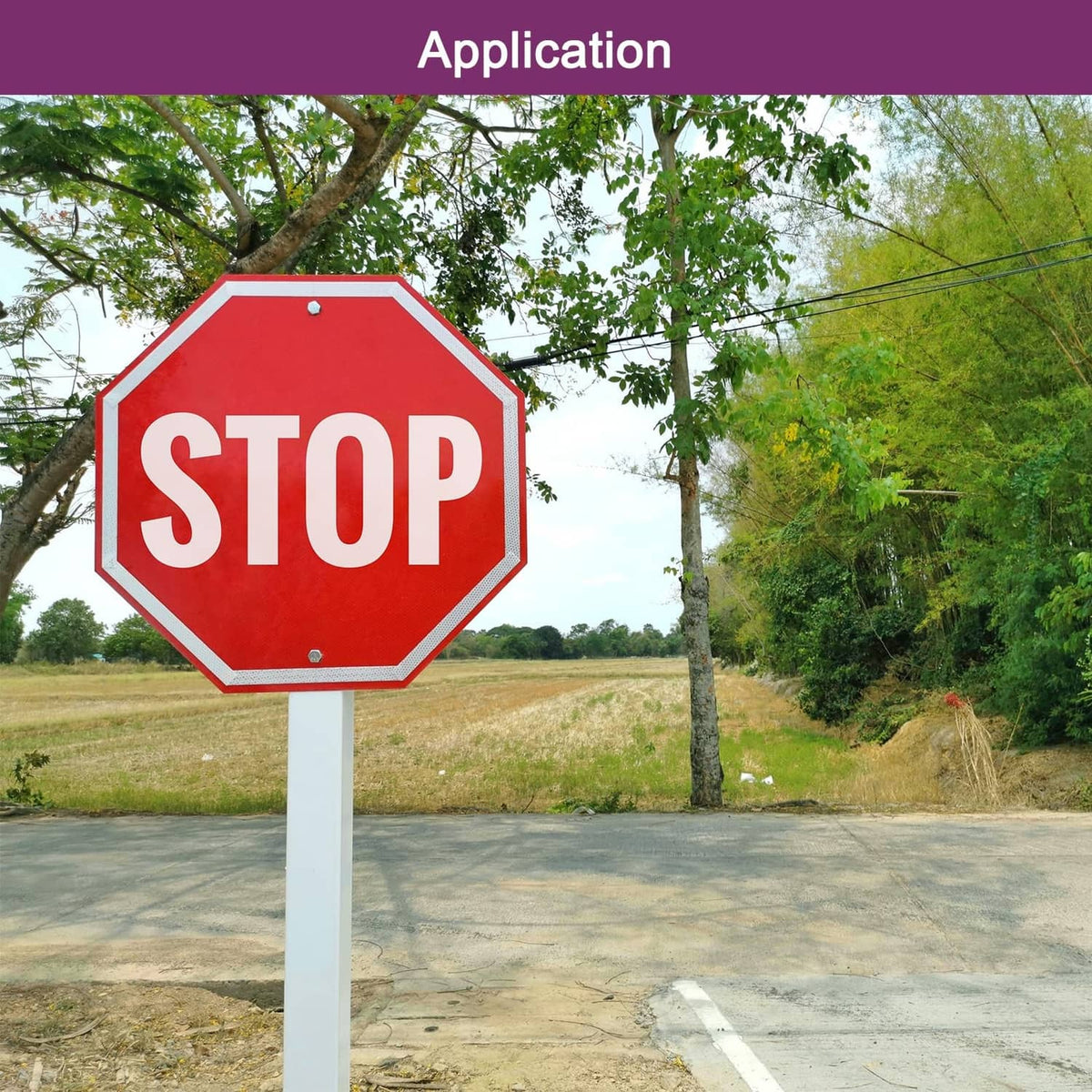 Octagonal red STOP sign with white letters on a white post