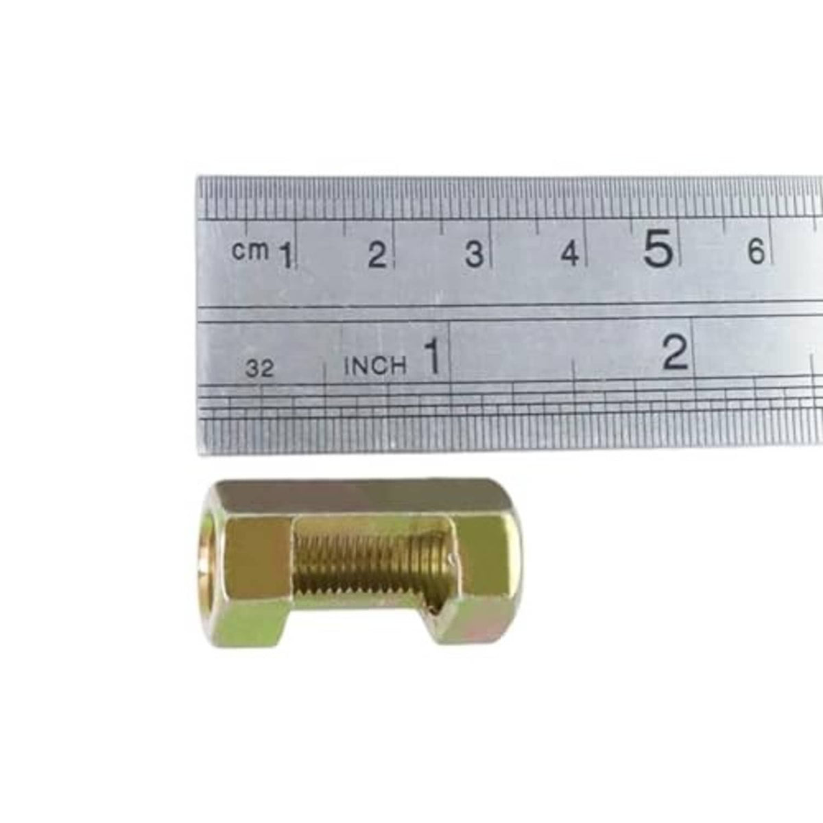 Gold-toned hex coupling nut with female thread, pictured beside a size ruler