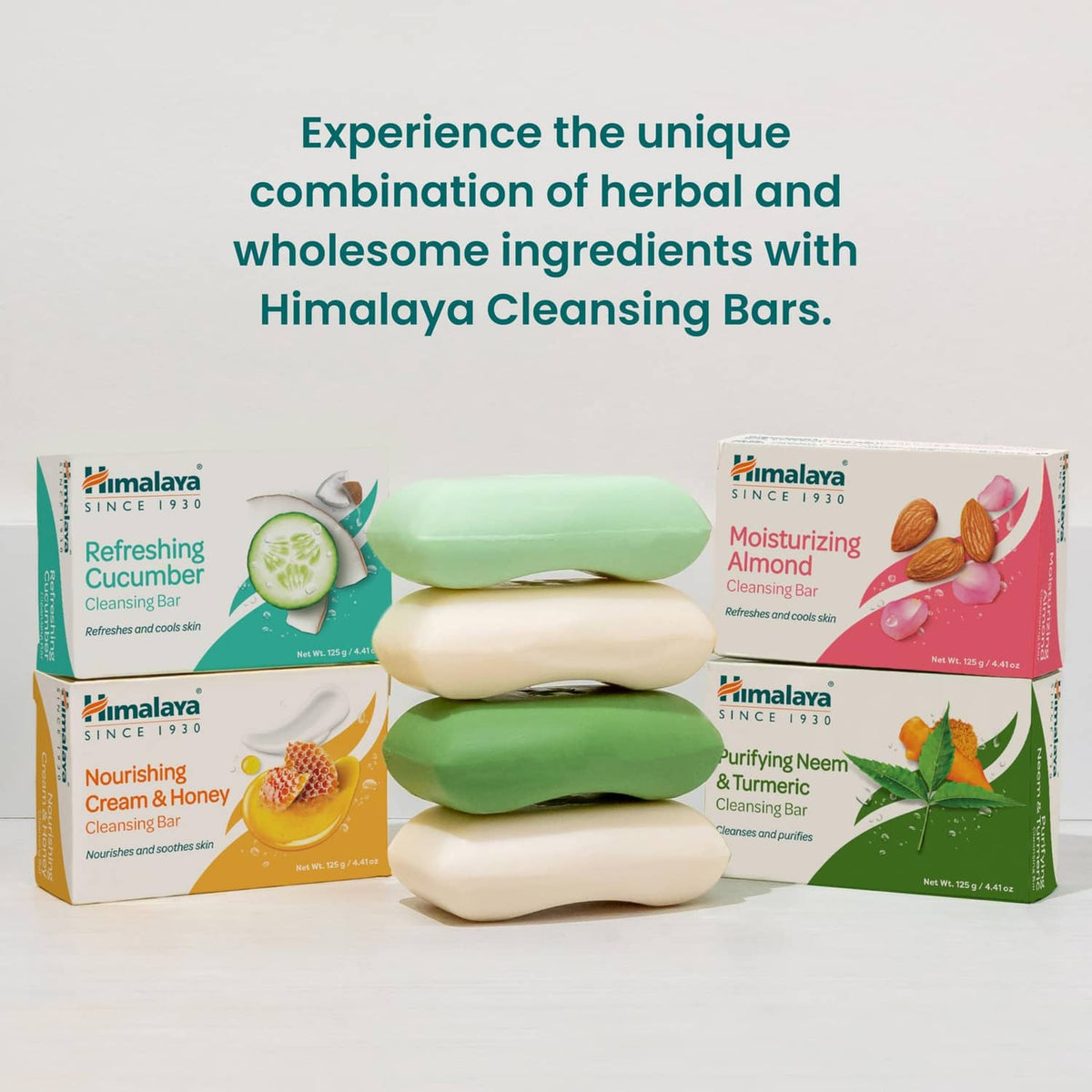 Cleansing bar lineup with green and cream soap bars in packs