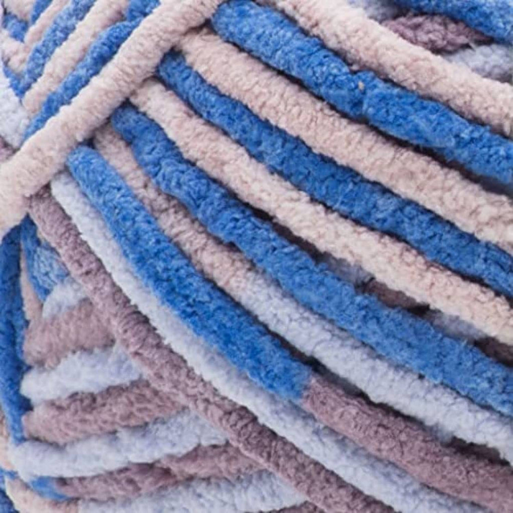 Close-up of striped knit fabric in blue, lavender, and light gray tones