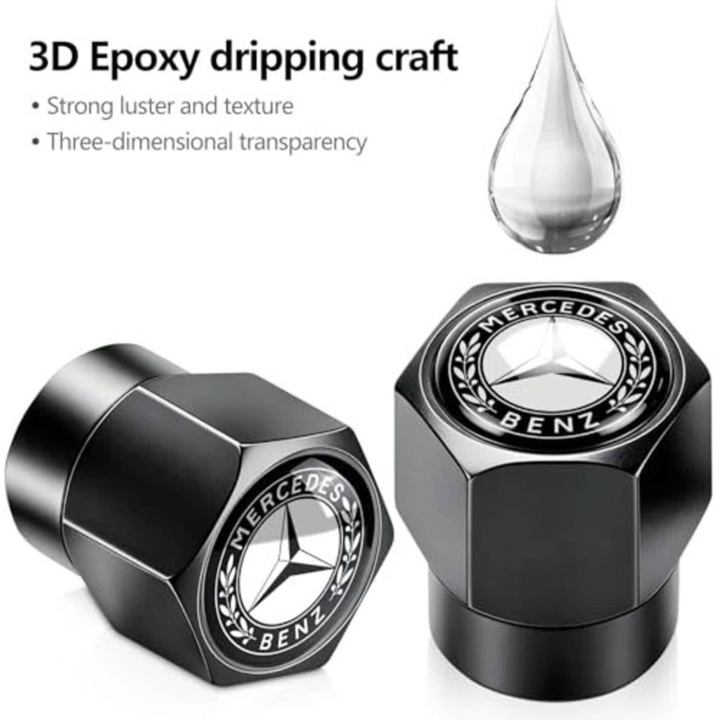 Black and chrome tire valve stem caps with Mercedes-Benz logo, angled close-up set