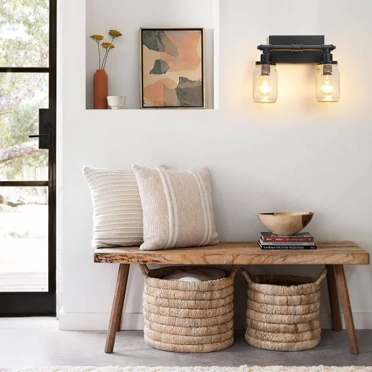 Black 2-light wall vanity light with two clear mason-jar shades and warm bulbs