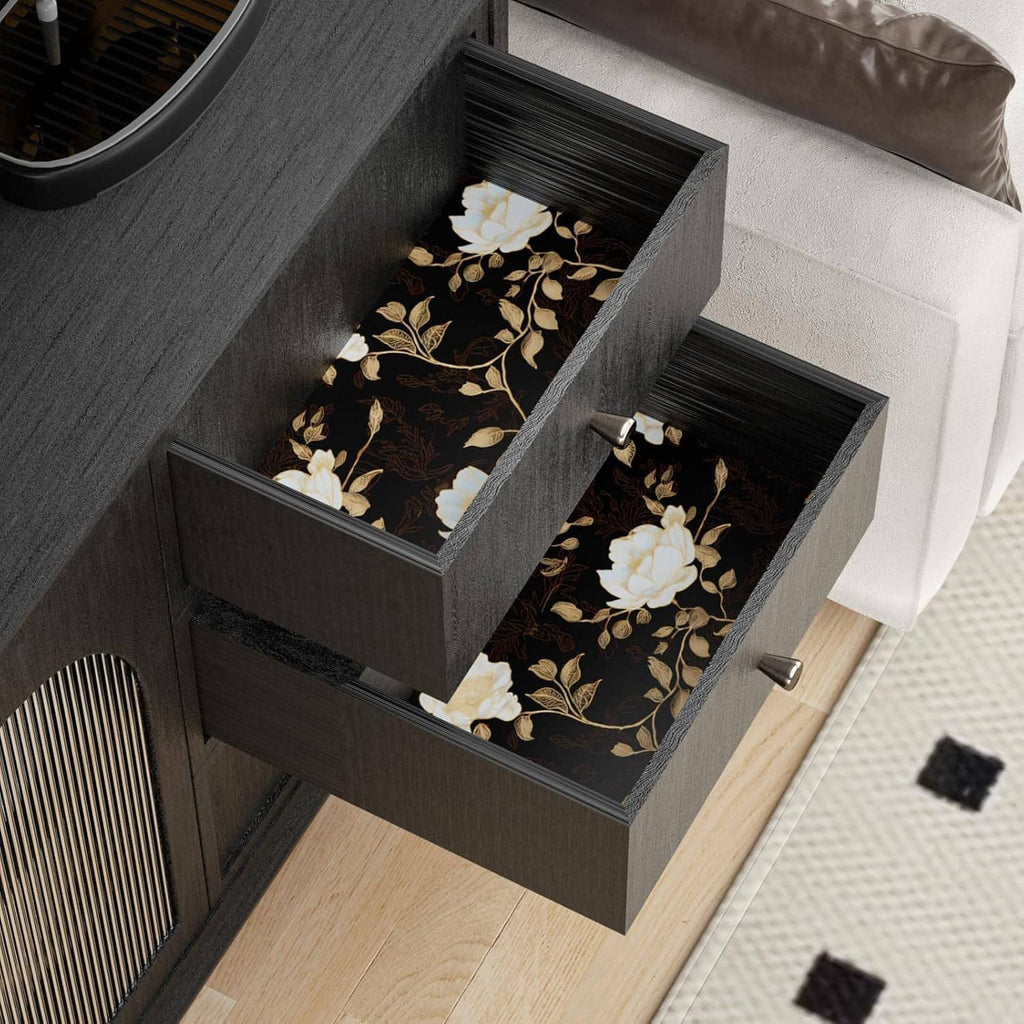 Black floral wallpaper with golden roses and leaves on drawer fronts and steps