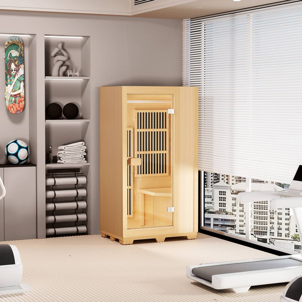 Light wood one-person sauna unit indoors with open glass door