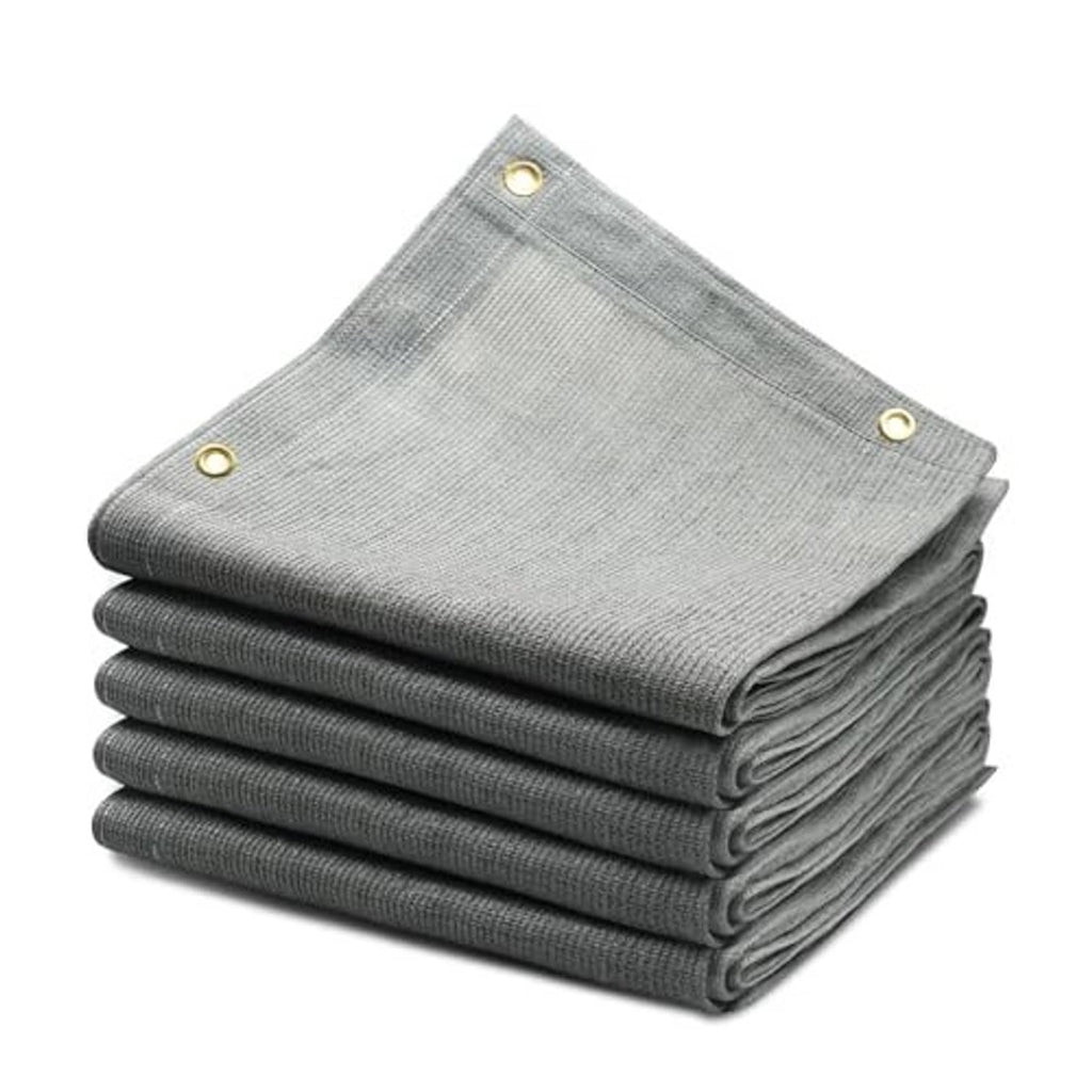Gray sun shade cloth stack with brass grommets, reinforced folded cover