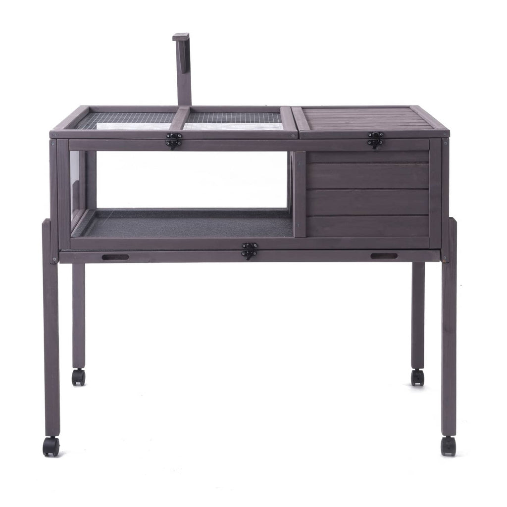 Gray wooden tortoise habitat with metal mesh sections and rolling casters, empty