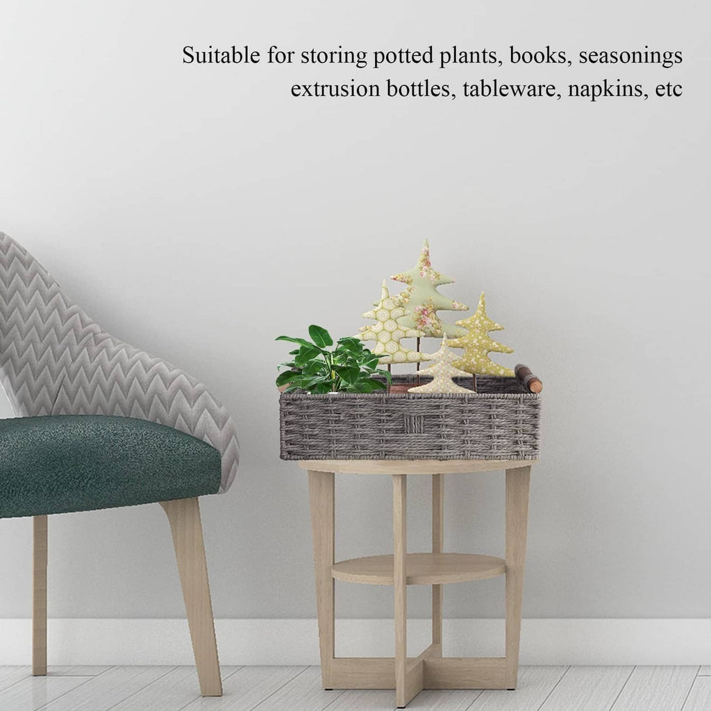 Grey woven storage basket on small stand with potted plant decor and wooden handles.