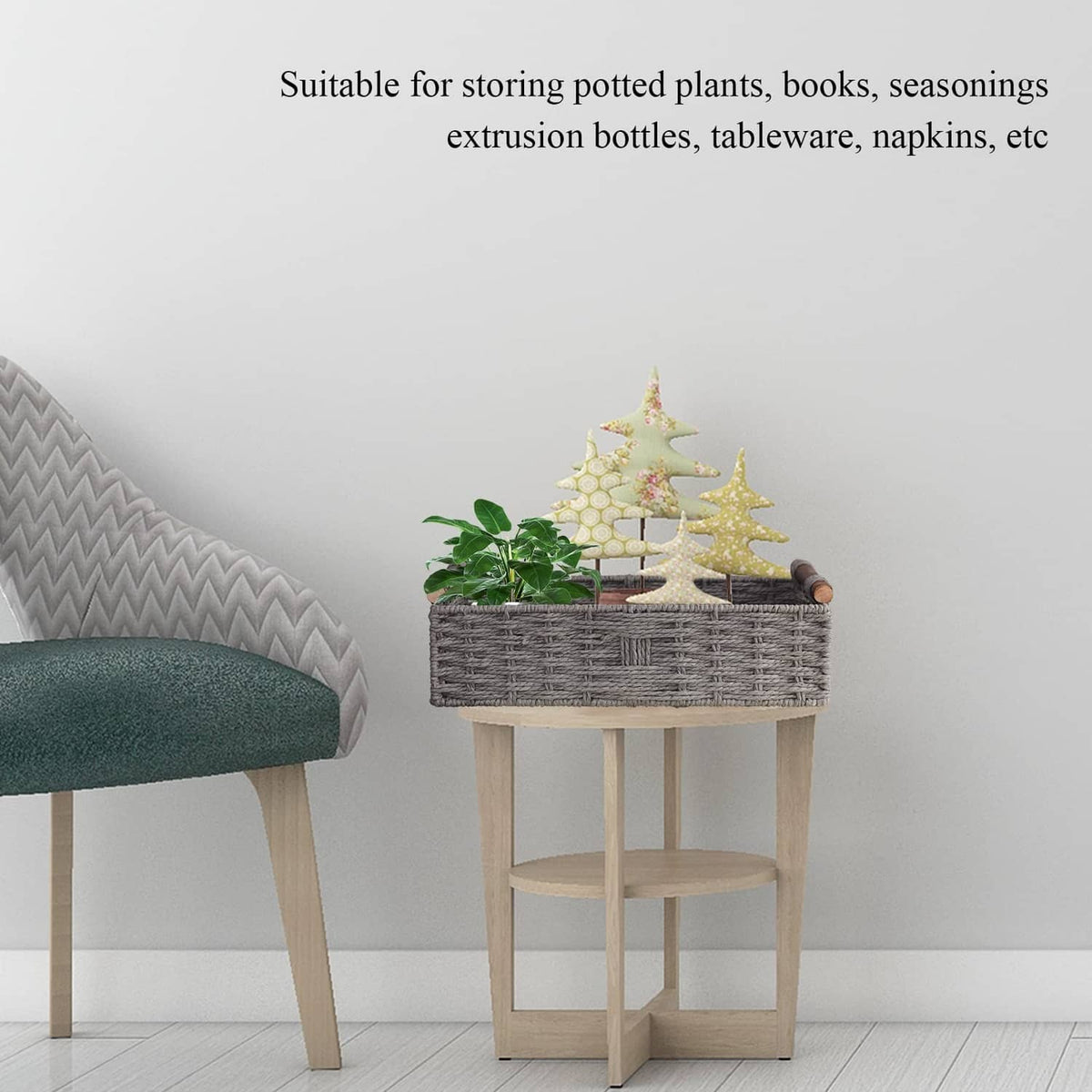 Grey woven storage basket on small stand with potted plant decor and wooden handles.