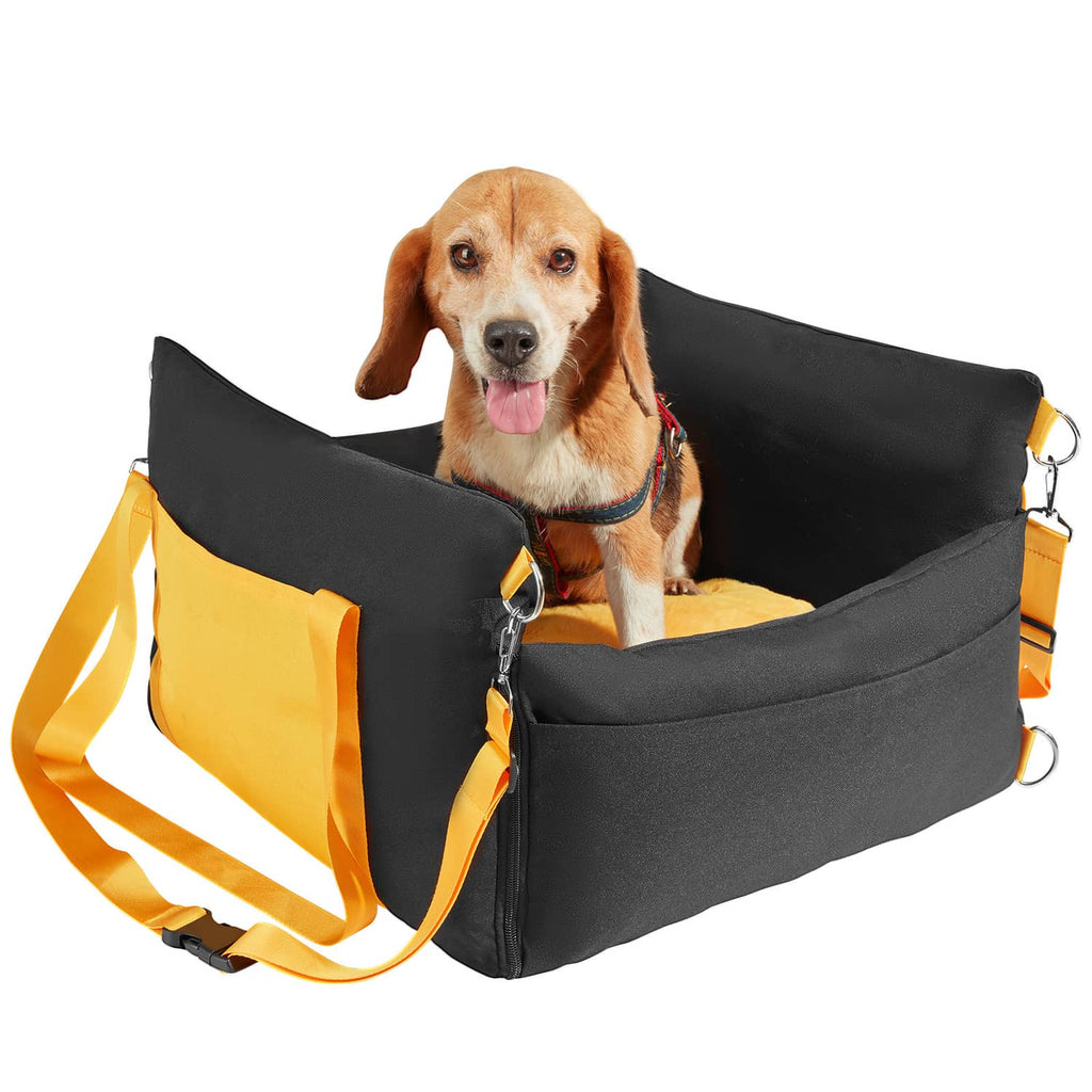 Black and yellow dog booster car seat with padded sides and safety straps, holding a small dog