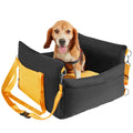 Black and yellow dog booster car seat with padded sides and safety straps, holding a small dog