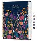 Academic planner, navy floral cover with twin-wire binding and month tabs on spine