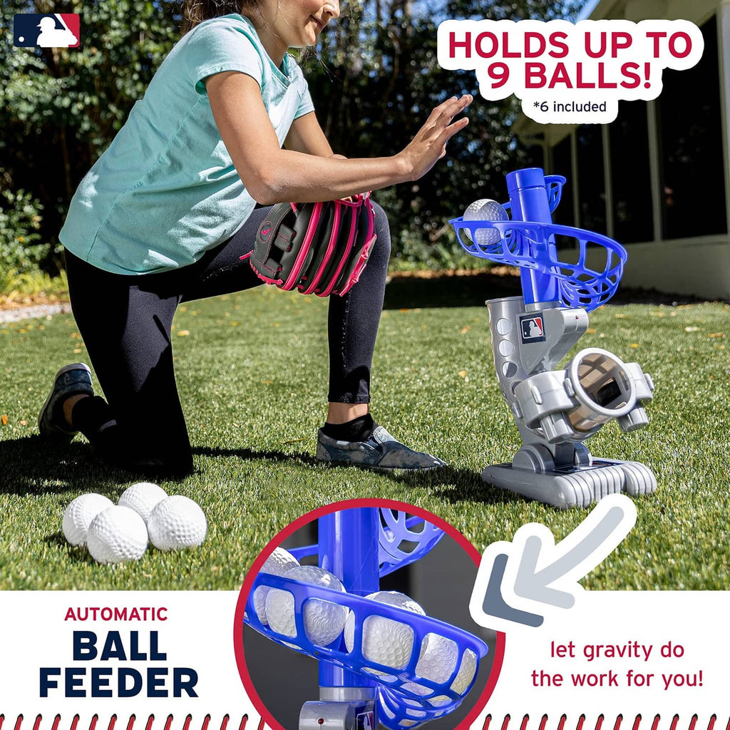 Automatic ball feeder pitching machine on grass, holding up to 9 balls with six included