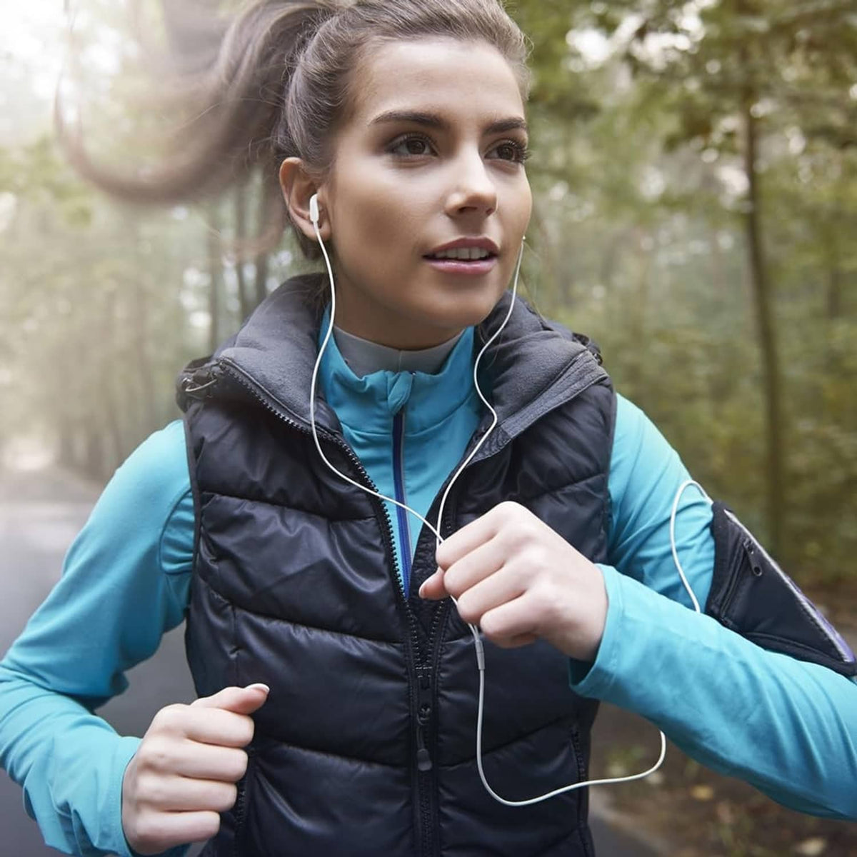 Woman wearing white wired in-ear USB-C headphones with cable and microphone
