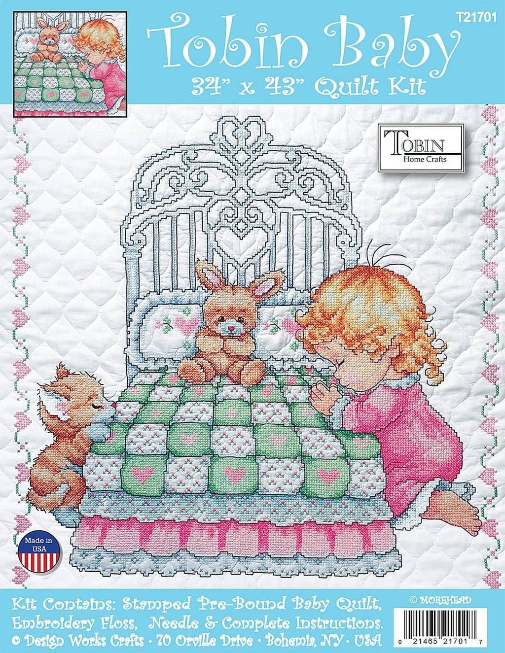 White quilt kit with stamped cross-stitch pattern showing girl kneeling beside bunny in cart