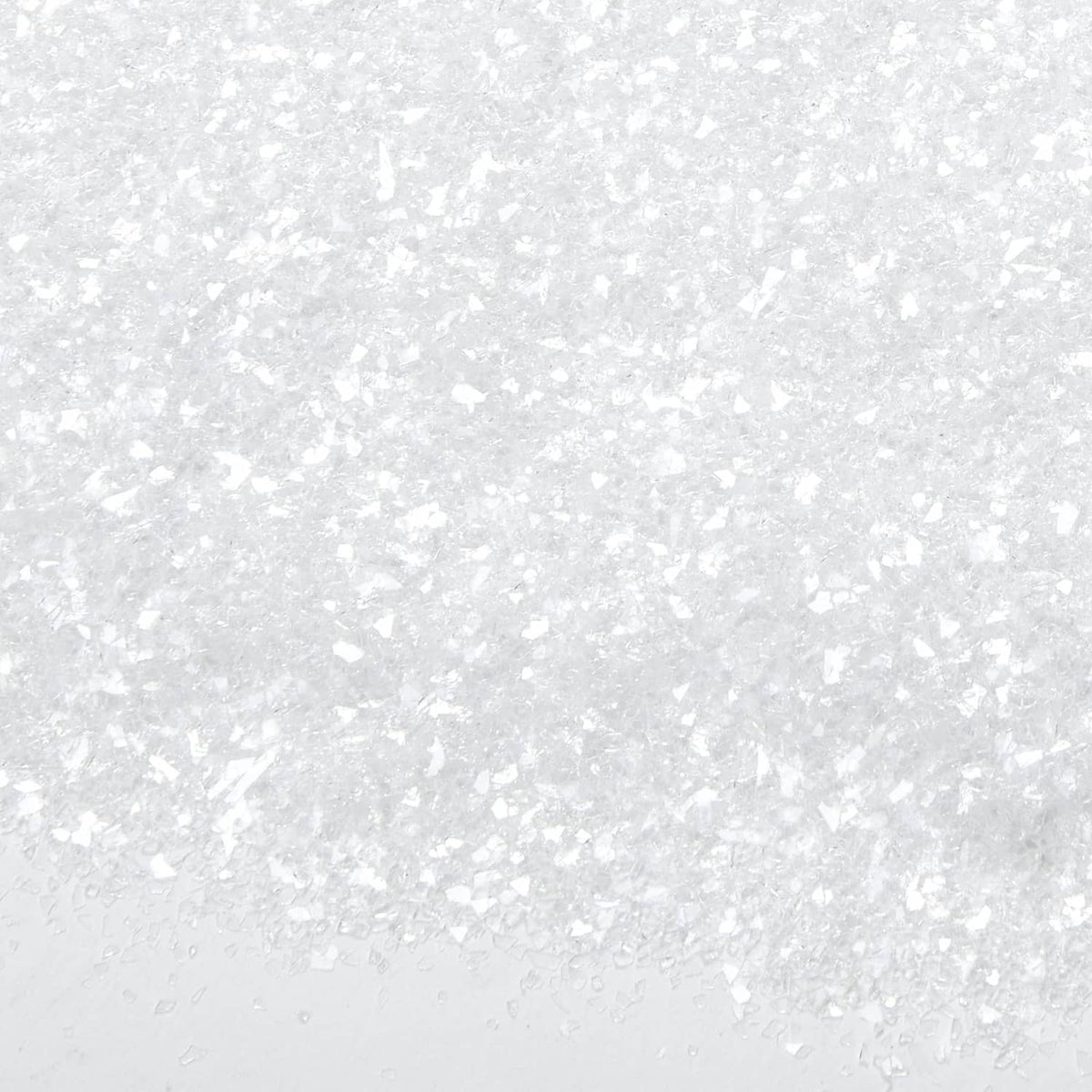 White diamond dust glitter texture on a light surface, fine sparkle flakes