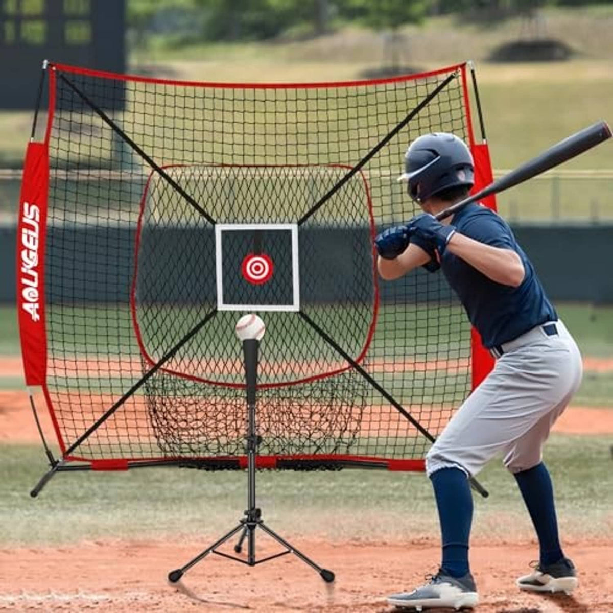 Red pitching practice net with black grid and square target on field