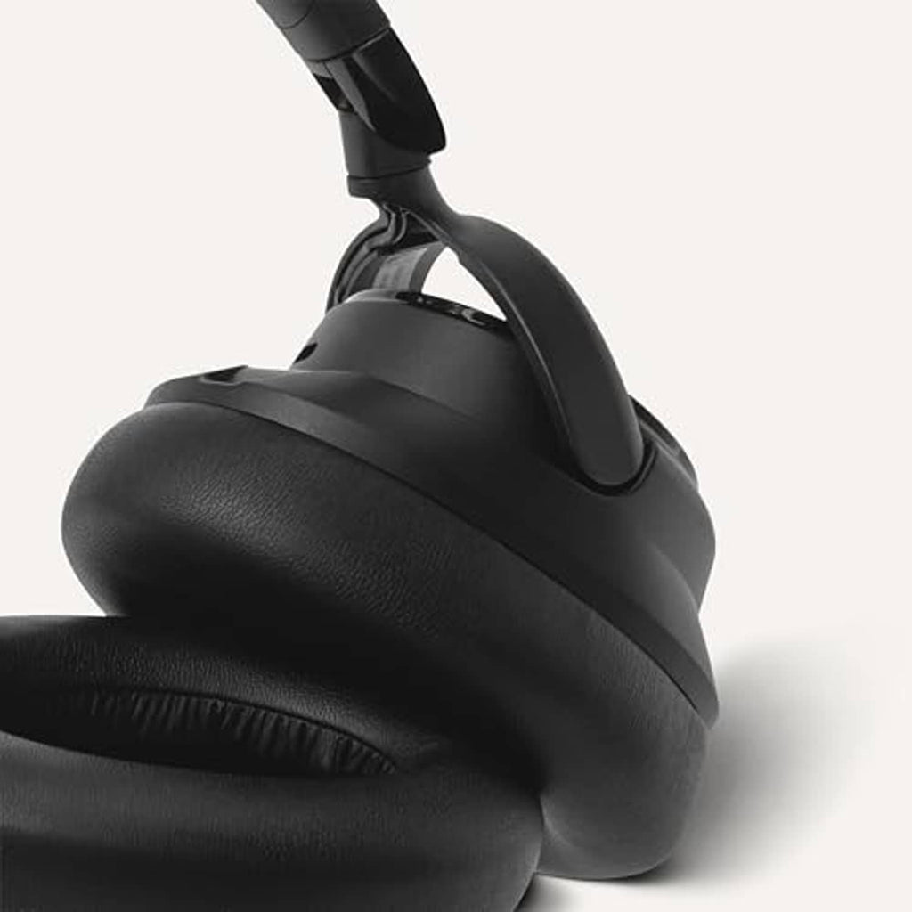 Black over-ear headphones close-up of soft ear cushions and headband