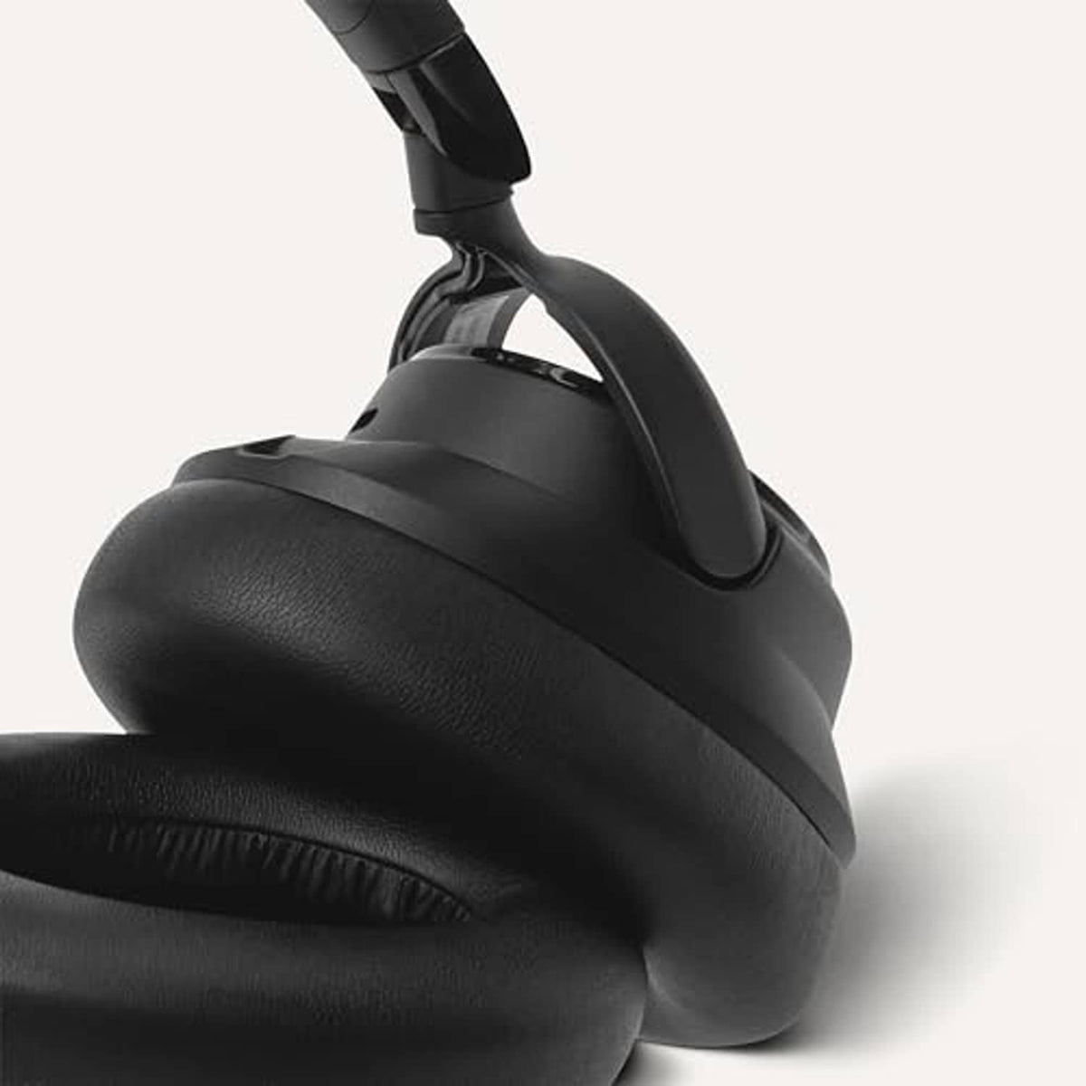 Black over-ear headphones close-up of soft ear cushions and headband