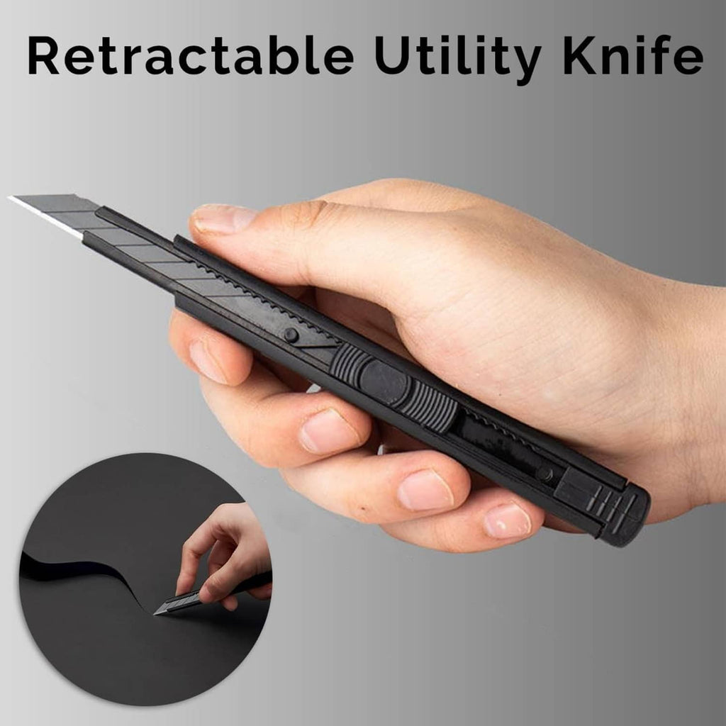 Retractable utility knife for cutting vinyl wrap, held in a hand