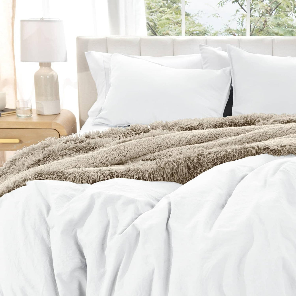 White duvet cover set with pillow shams and white duvet, with gray faux fur throw