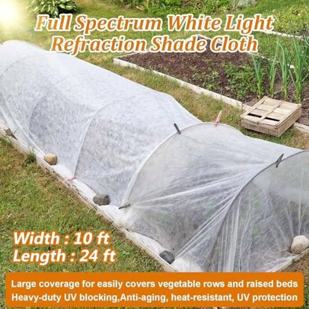 White sun shade cloth draped over garden row on a low hoop frame.