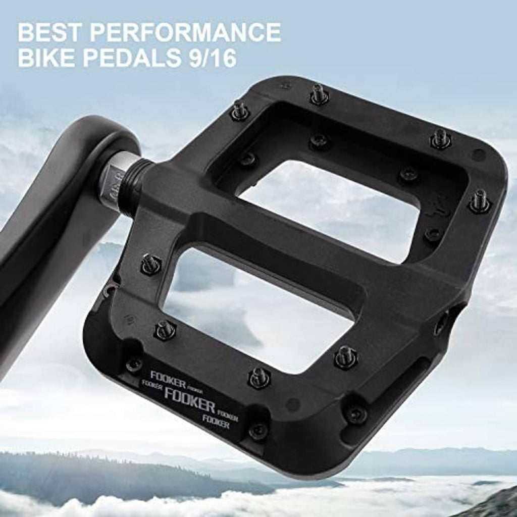 Black MTB flat pedal with open grip platform and threaded axle