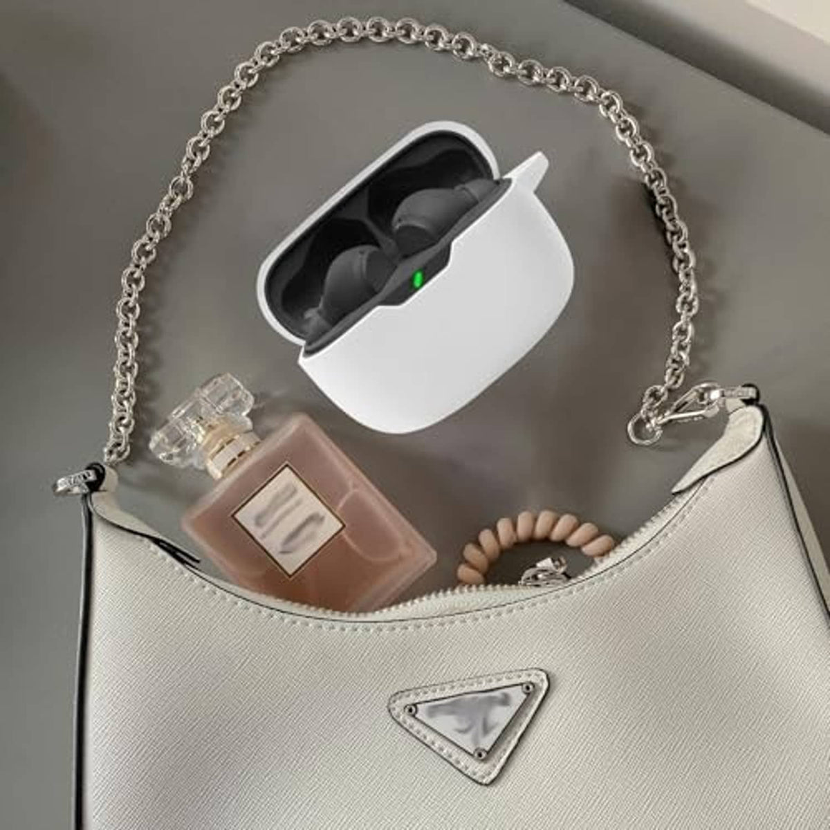 White soft silicone earbud case cover with silver chain and keychain charms