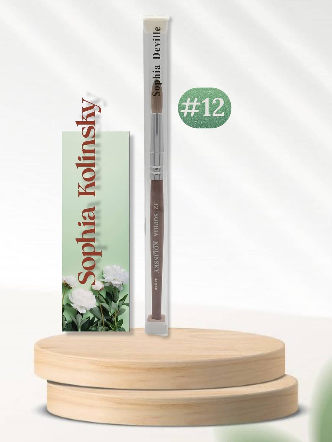 Round nail brush size #12, brown bristles, red handle in clear sleeve