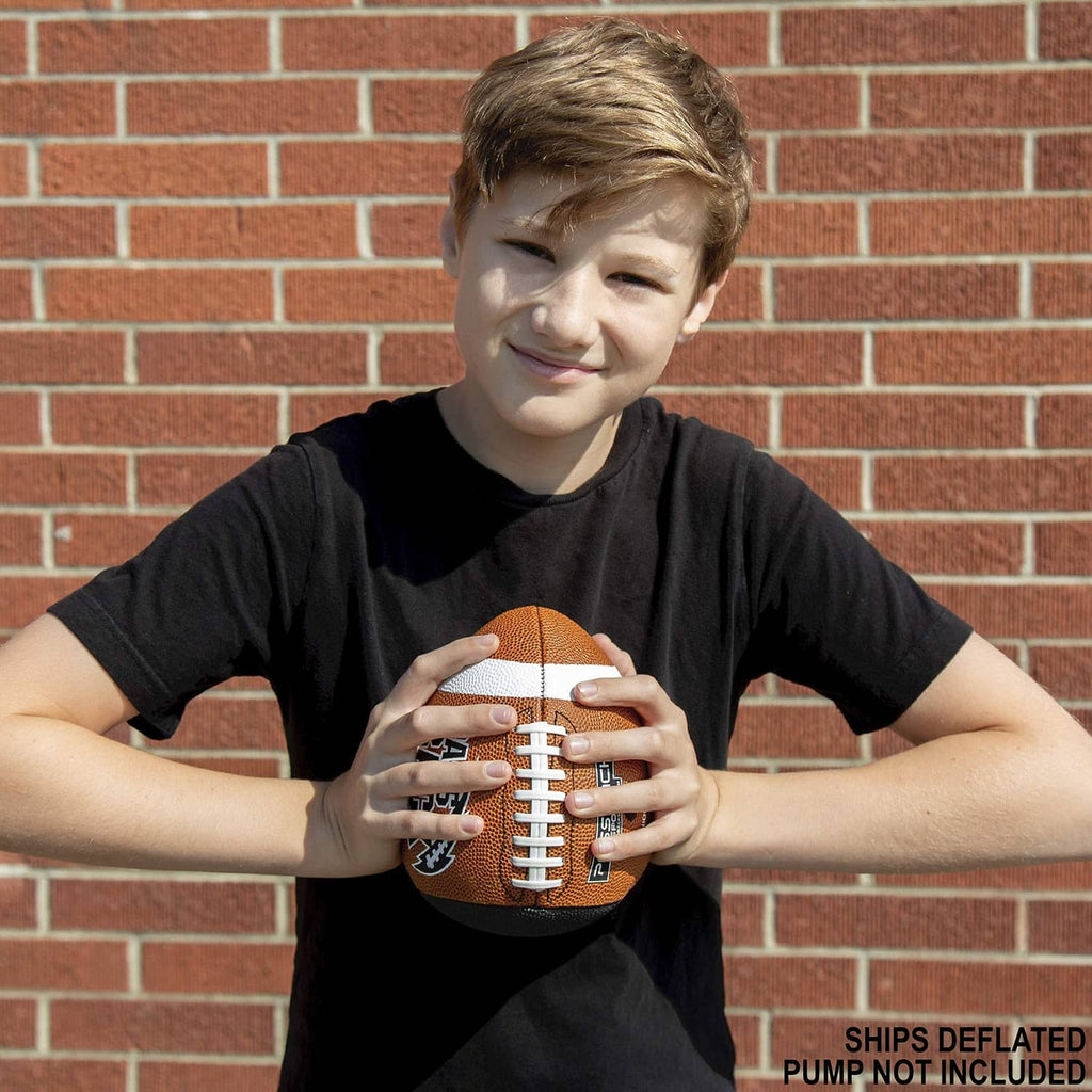 Smiling child holding an orange youth composite football with white stripe accents
