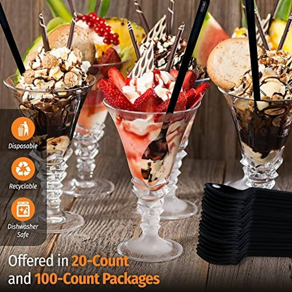 Black disposable long-handle spoons in tall dessert cups, stacked in the background