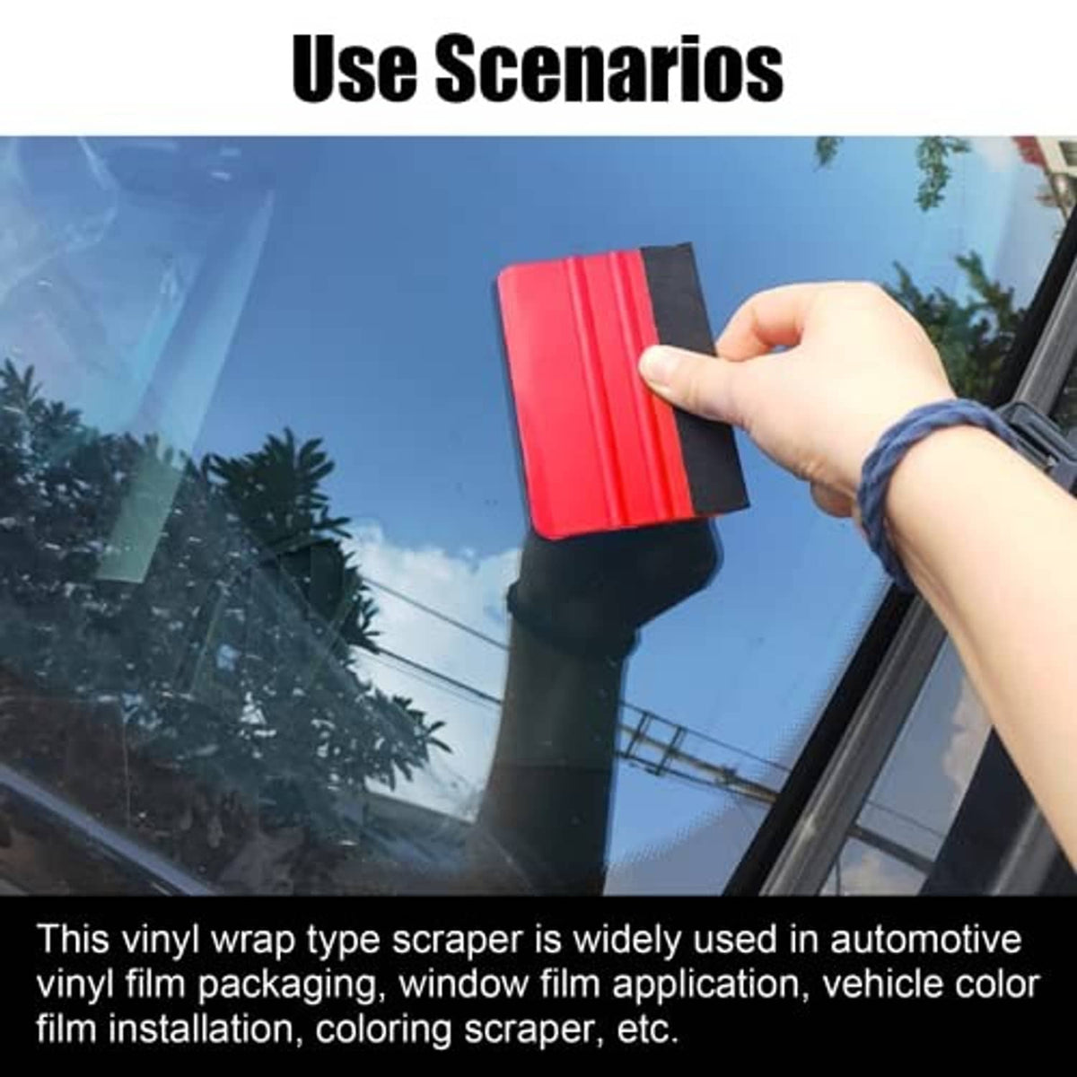 Red felt-edge squeegee held against automotive window film for removing bubbles