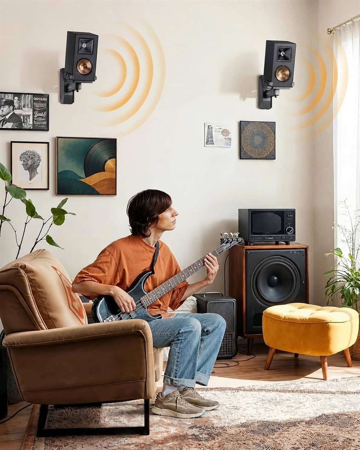 Pair of black speaker wall mount brackets holding small bookshelf speakers