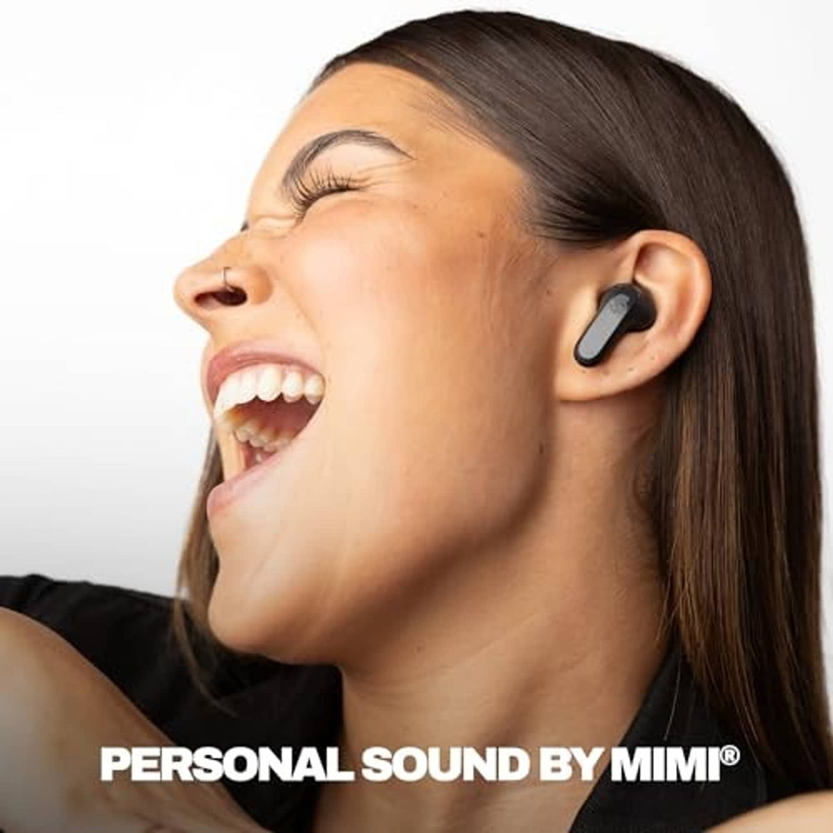 Woman wearing black wireless earbuds in her ear