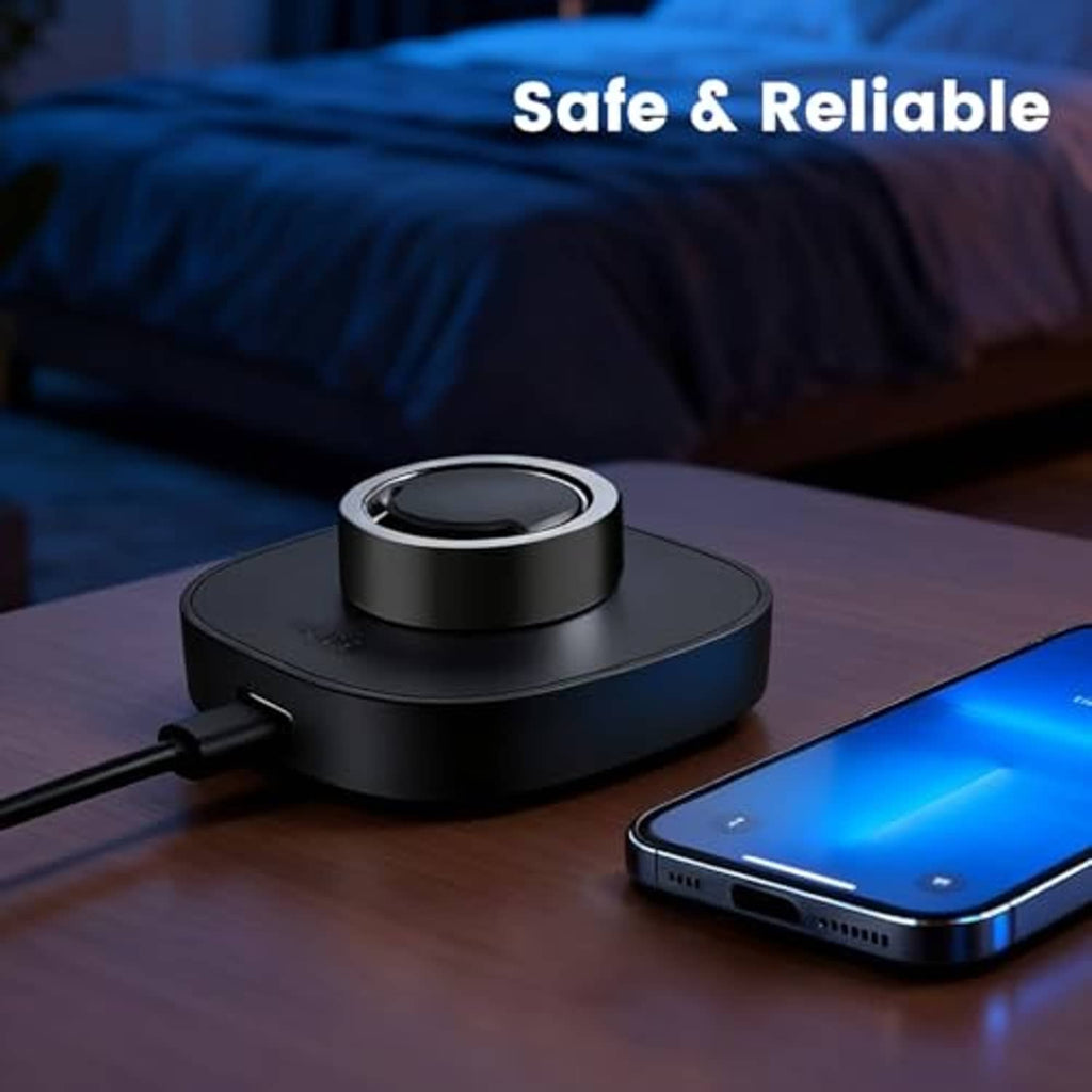 Black smart ring charging dock with circular cradle on a wooden surface