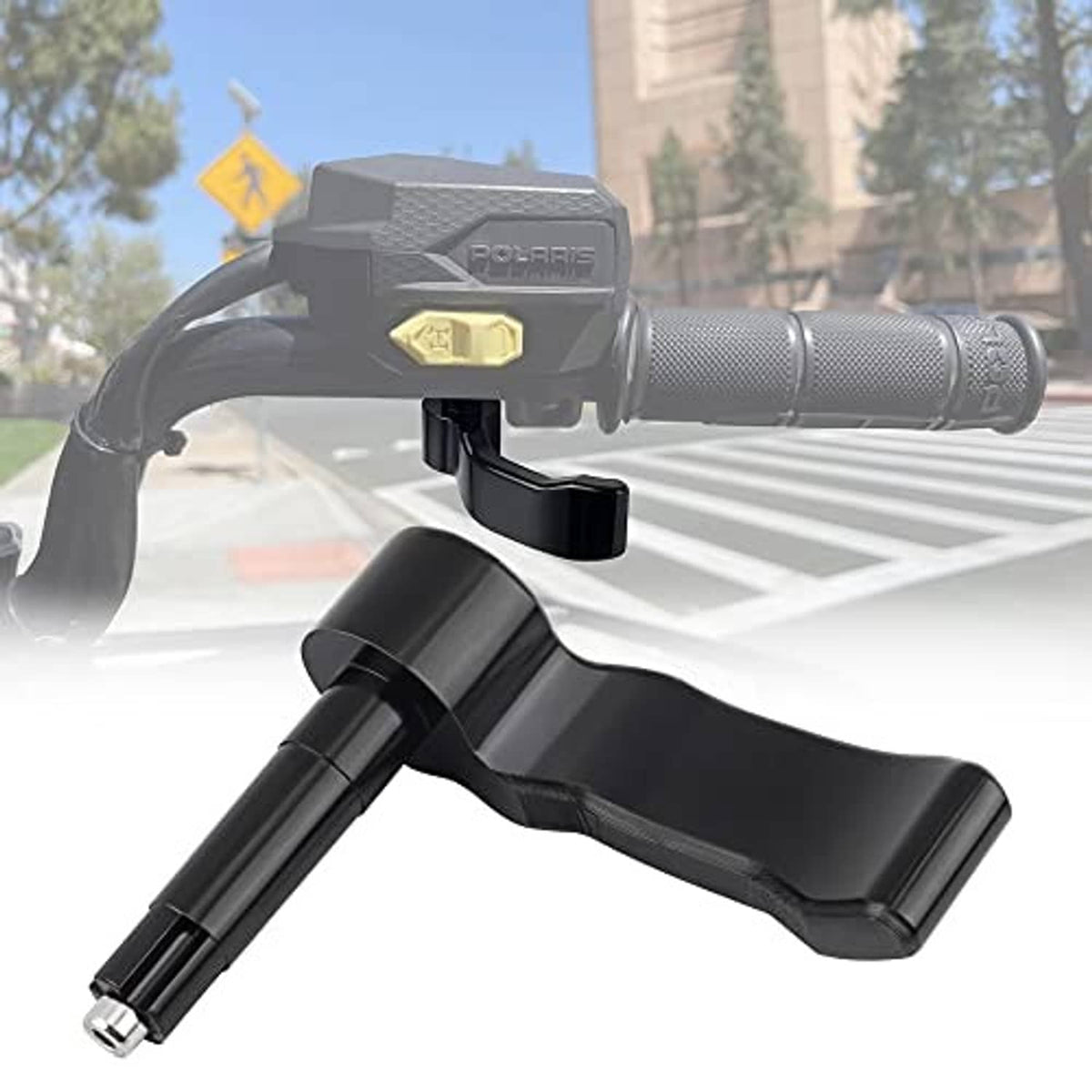 Black thumb throttle lever positioned near textured handlebar grip