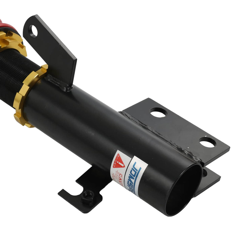 Black coilover shock absorber with mounting brackets and red coil spring
