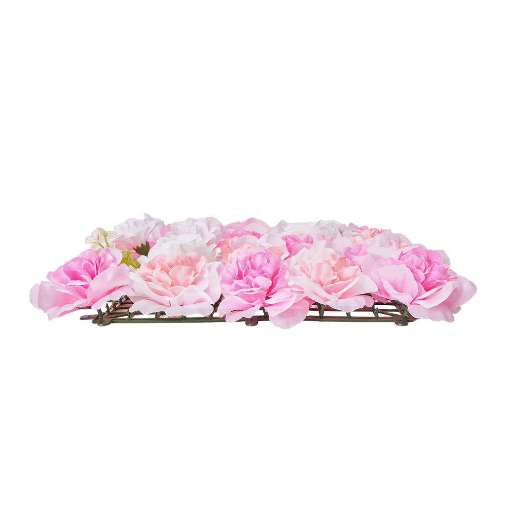 Artificial pink and white 3D flower panel mat with green base frame, side view