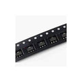 SOT-89 LDO voltage regulator ICs, black surface-mount chips on strip with pins