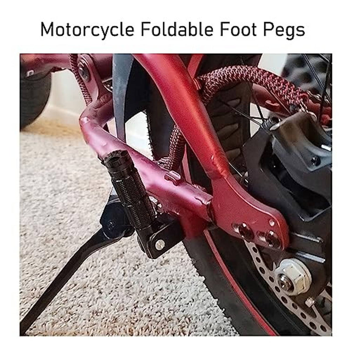 Foldable motorcycle foot peg mounted to red bike frame, with textured black grip