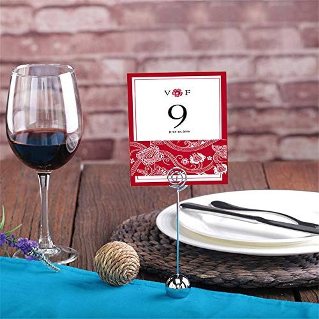Silver wire card holder with round spiral loop, holding a square table card