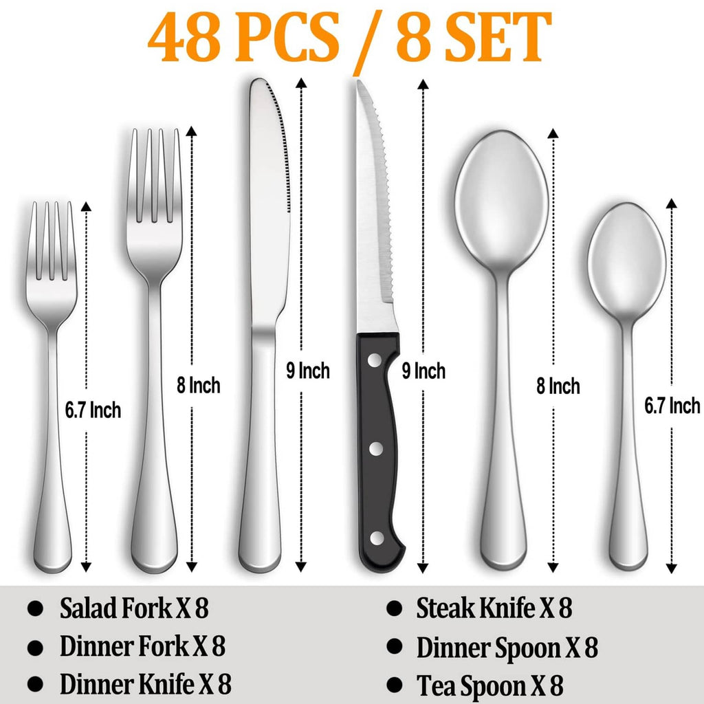 Assorted stainless steel flatware pieces, including steak knives and serving utensils