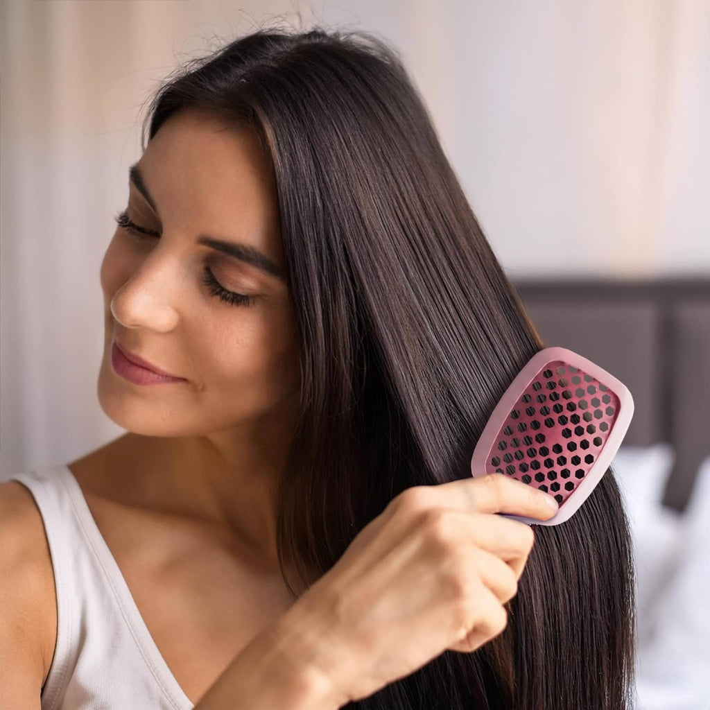 Light pink detangling hair brush with square cushion and pink bristles