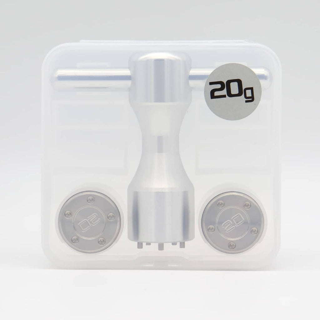 Clear case holding two silver 20g weight plates and the wrench tool