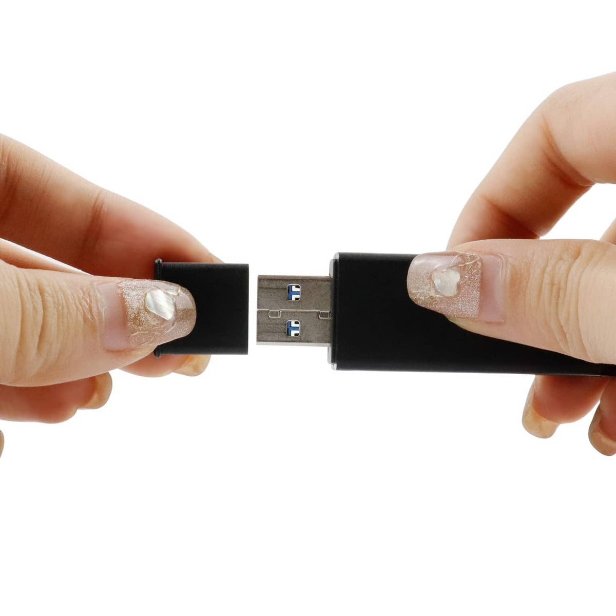USB Type-A male dust cap being pressed onto a USB plug, black plastic