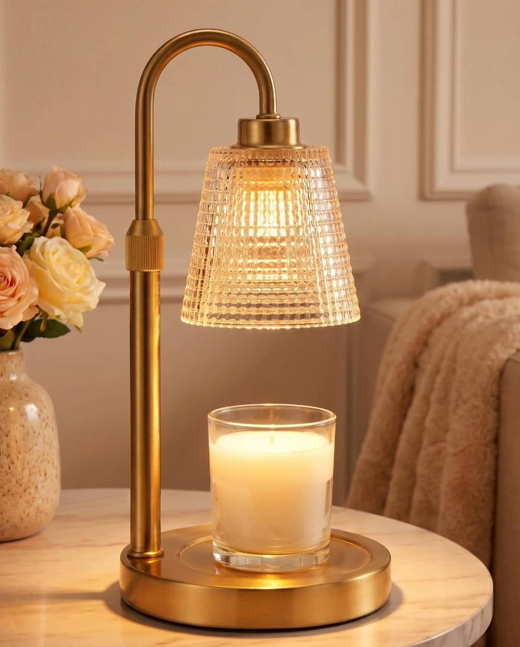 Gold candle warmer lamp with lattice glass shade and brass base, warming a jar candle